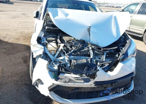 2021 Toyota C-Hr Le z USA, uszkodzony, nr VIN JTNKHMBX7M1121302